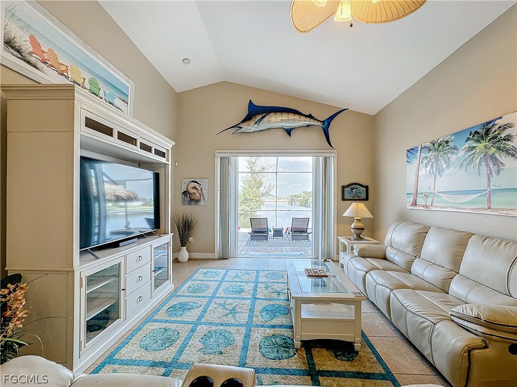 2115 Old Burnt Store Road North Cape Coral, FL 33993 - Photo 12 of 33 a living room with furniture and a flat screen tv