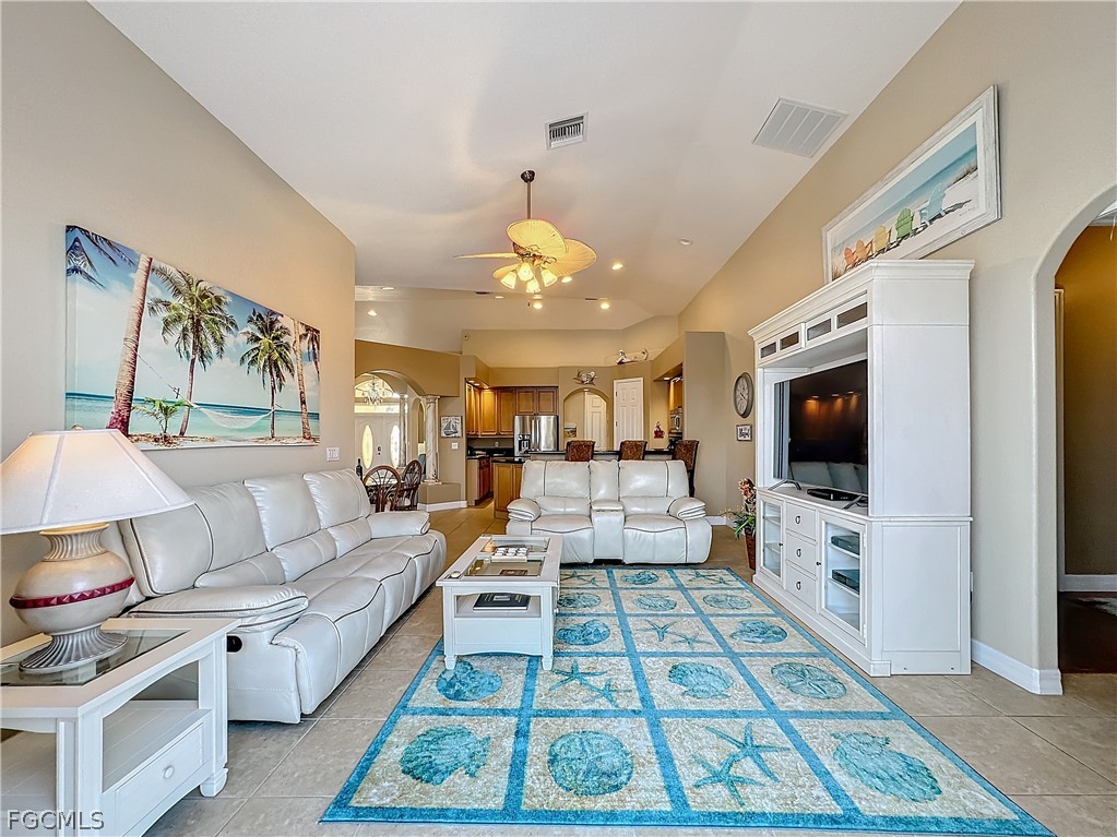 2115 Old Burnt Store Road North Cape Coral, FL 33993 - Photo 13 of 33 a living room with furniture and a flat screen tv
