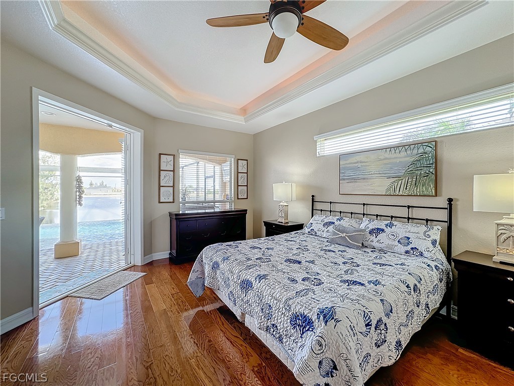 2115 Old Burnt Store Road North Cape Coral, FL 33993 - Photo 14 of 33 a bedroom with a large bed and a window