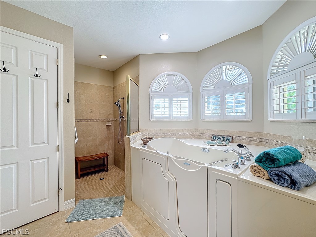 2115 Old Burnt Store Road North Cape Coral, FL 33993 - Photo 17 of 33 a utility room with two dryer washer and a glass door