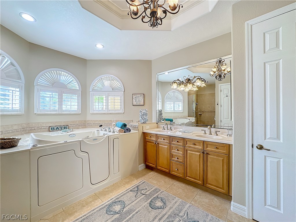 2115 Old Burnt Store Road North Cape Coral, FL 33993 - Photo 18 of 33 a large white kitchen with a stove a sink dishwasher and a refrigerator