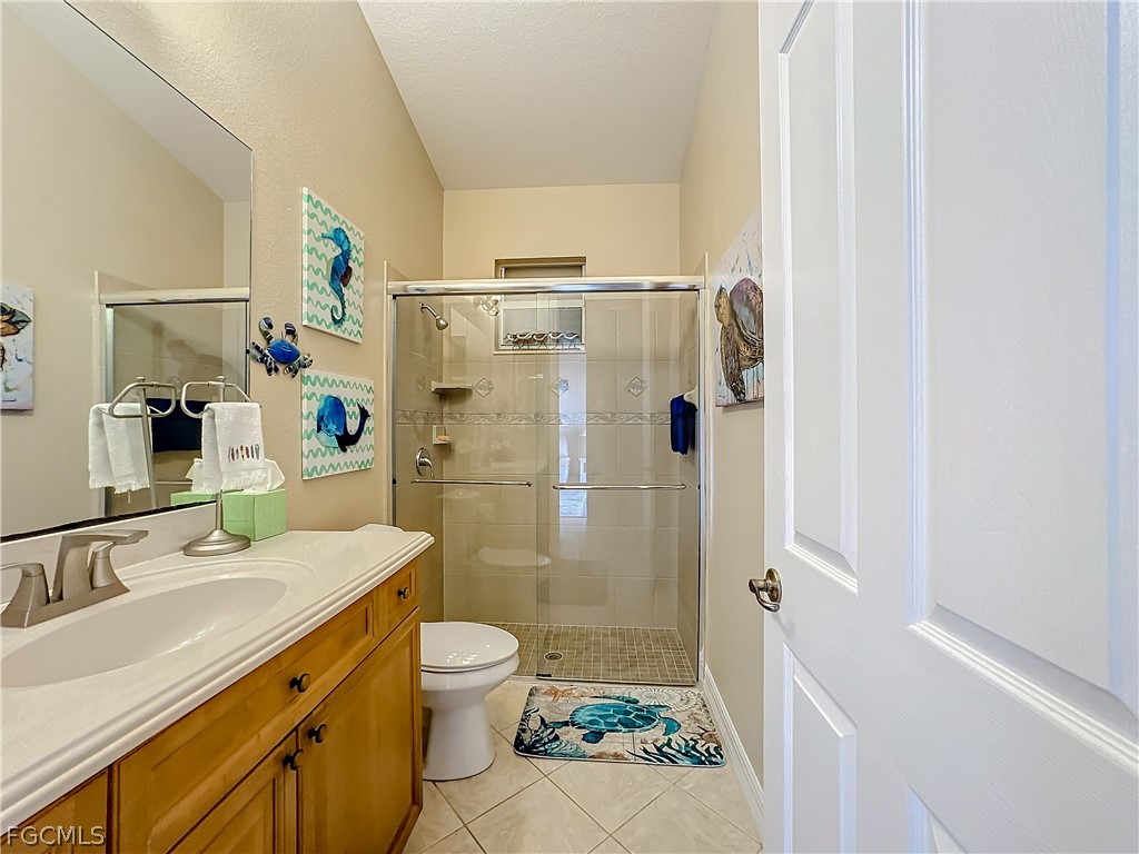 2115 Old Burnt Store Road North Cape Coral, FL 33993 - Photo 22 of 33 a bathroom with a sink toilet and shower