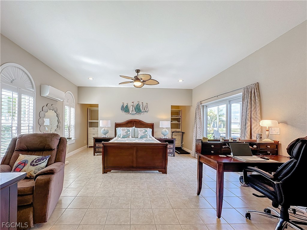 2115 Old Burnt Store Road North Cape Coral, FL 33993 - Photo 23 of 33 a living room with furniture a window and a flat screen tv