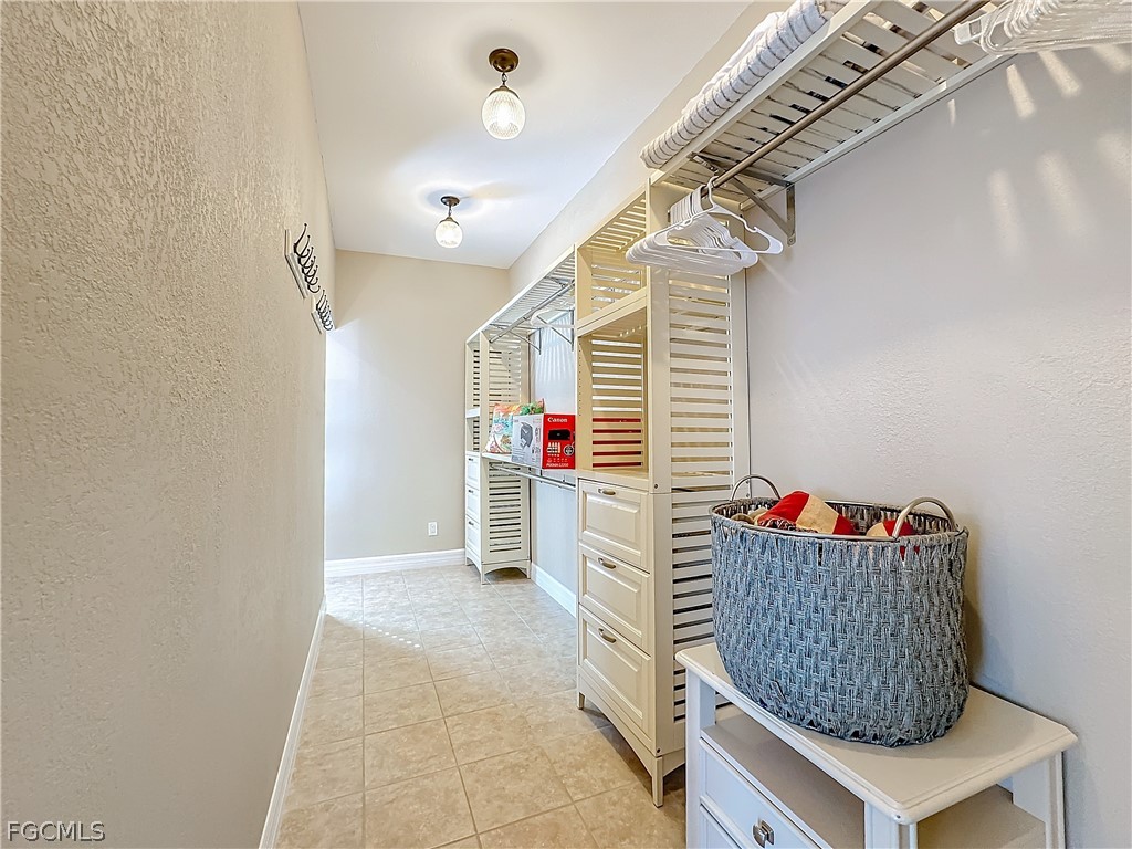 2115 Old Burnt Store Road North Cape Coral, FL 33993 - Photo 24 of 33 a living room with furniture and a potted plant