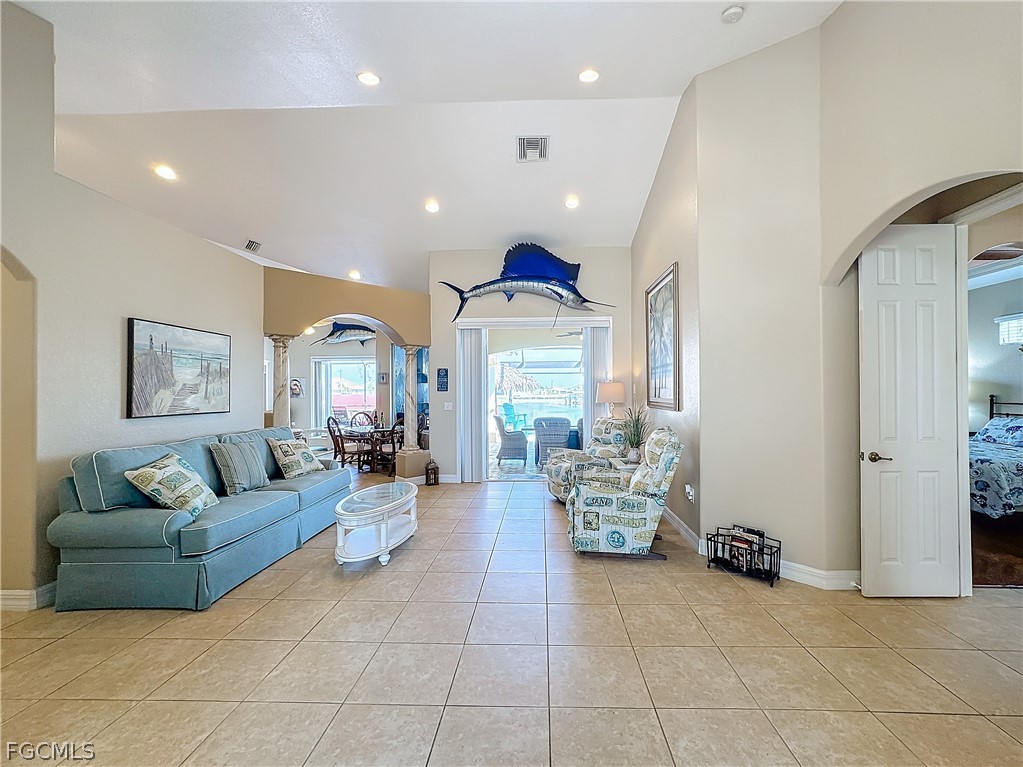 2115 Old Burnt Store Road North Cape Coral, FL 33993 - Photo 25 of 33 a living room with furniture and a chandelier