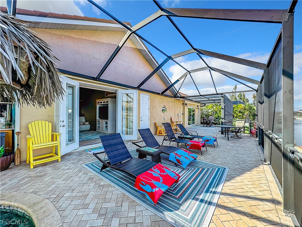 2115 Old Burnt Store Road North Cape Coral, FL 33993 - Photo 30 of 33 a view of swimming pool with a lounge chairs in patio