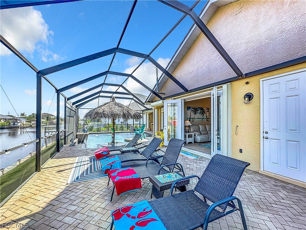2115 Old Burnt Store Road North Cape Coral, FL 33993 - Photo 31 of 33 a view of a patio with a table and chairs