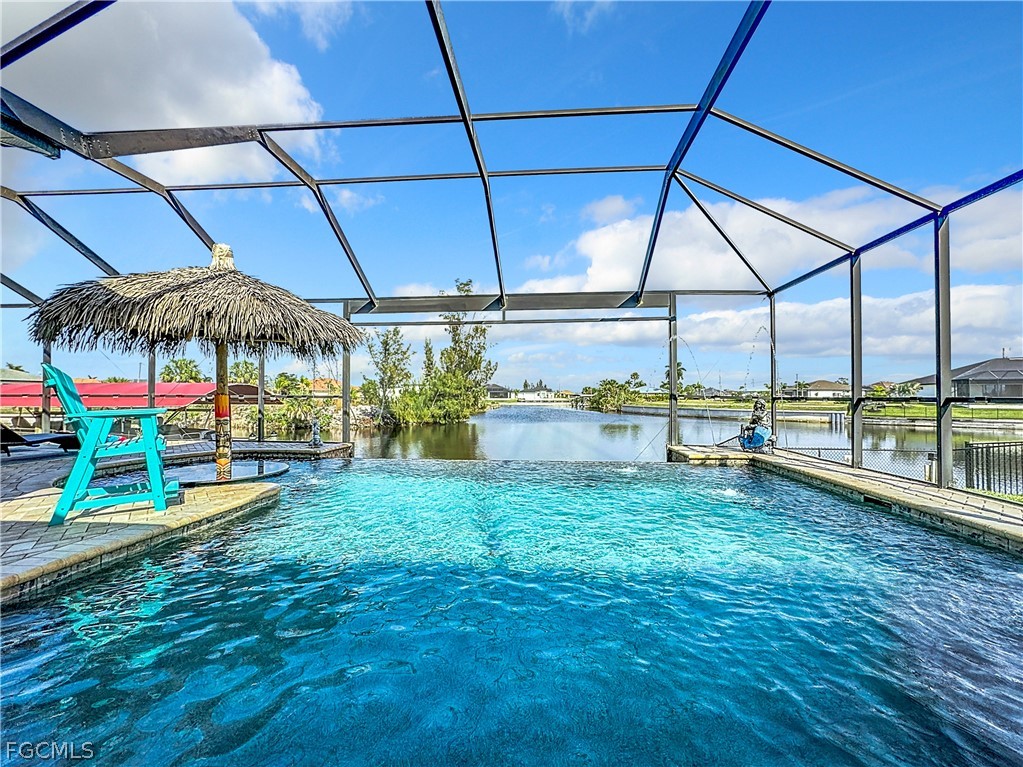 2115 Old Burnt Store Road North Cape Coral, FL 33993 - Photo 5 of 33 a view of swimming pool with a patio