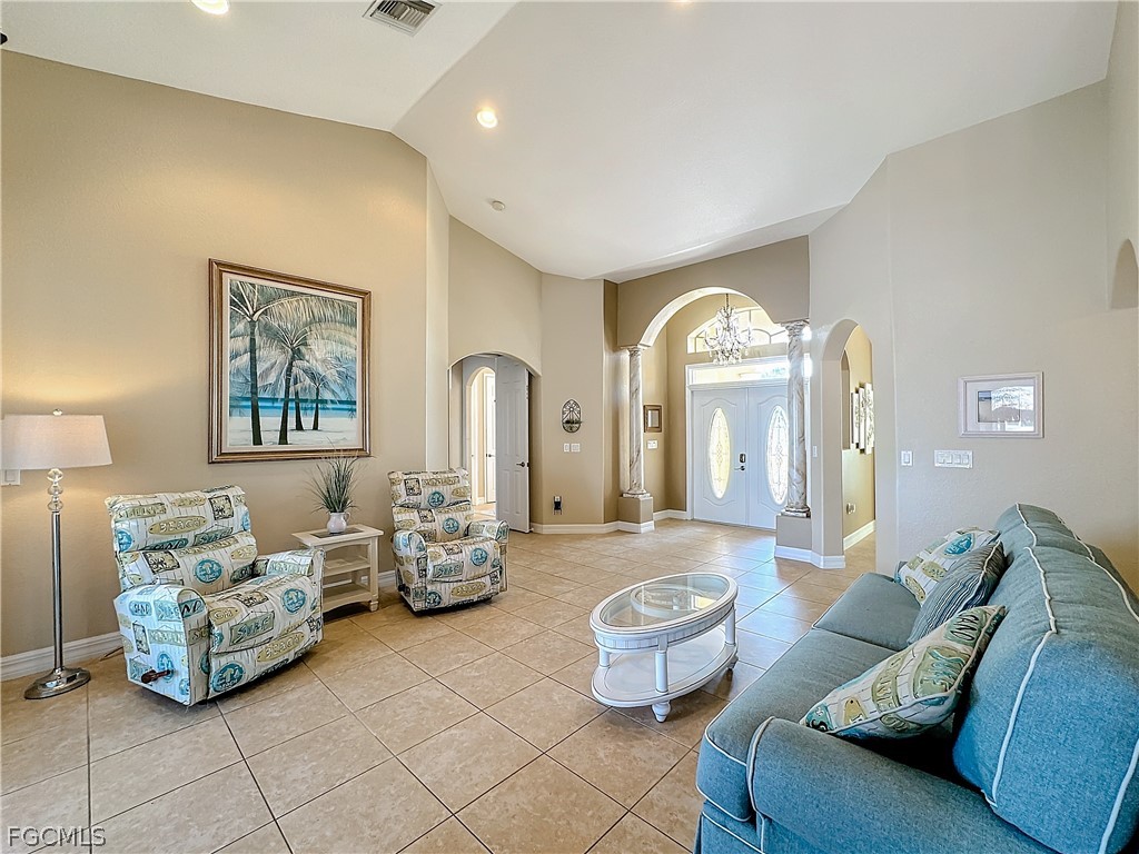 2115 Old Burnt Store Road North Cape Coral, FL 33993 - Photo 7 of 33 a living room with furniture flowerpot and a rug