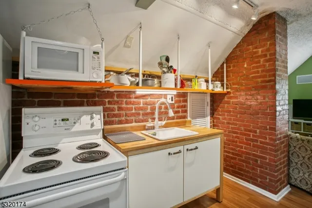 a bathroom with a sink and a stove