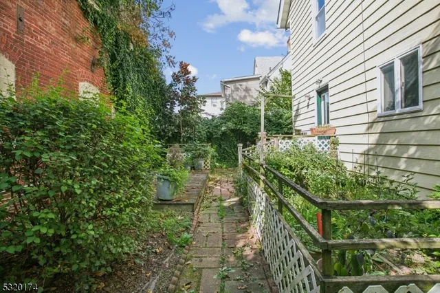 a view of a house with a tree