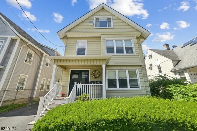 a front view of a house with a porch