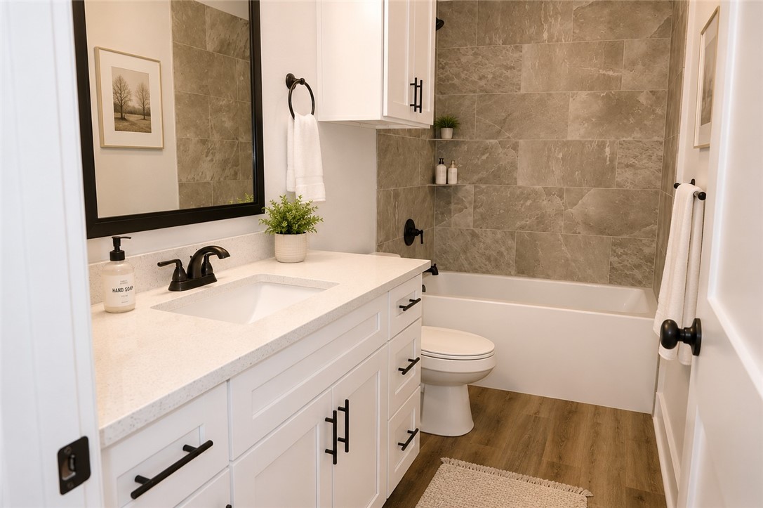 2004 Reagan Court Bryan, TX 77802 - Photo 8 of 19 a bathroom with a sink a toilet and shower