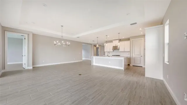 a view of a kitchen with wooden floor