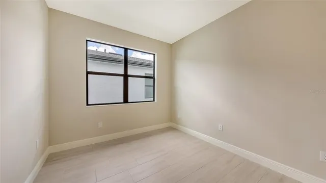 a view of a big room with wooden floor and seating space