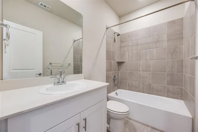 a bathroom with a sink a toilet and a bathtub