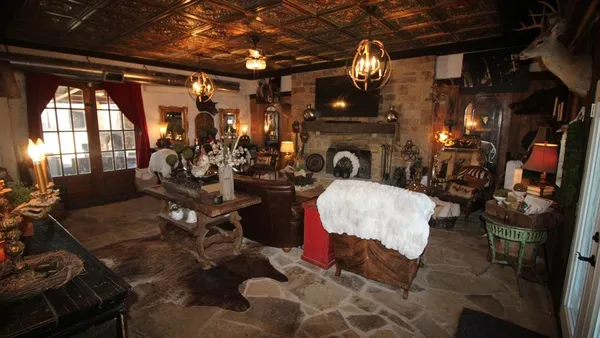 a living room with fireplace furniture and a fireplace