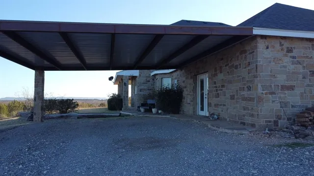 a living room with furniture a fireplace and a table
