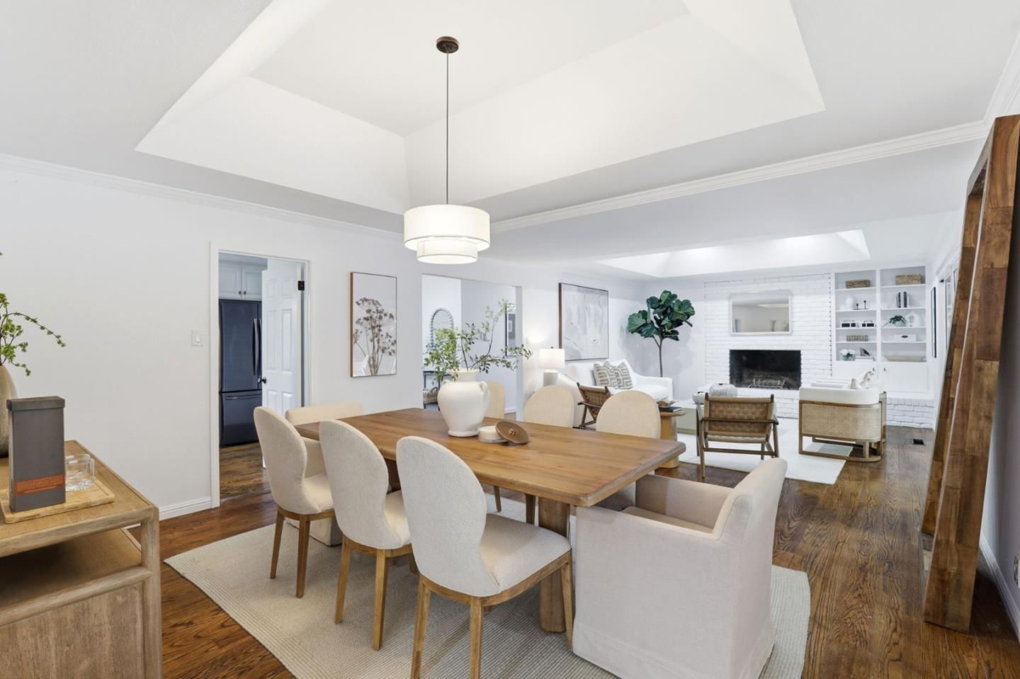 425 Summit Spring Road Woodside, CA 94062 - Photo 11 of 42 a view of a dining room with furniture wooden floor and a chandelier