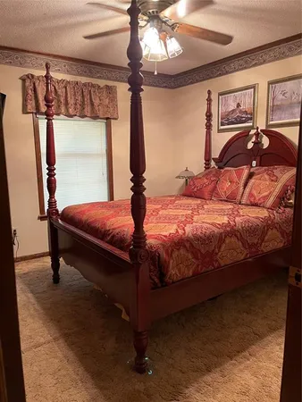 a bedroom with a bed and a mirror