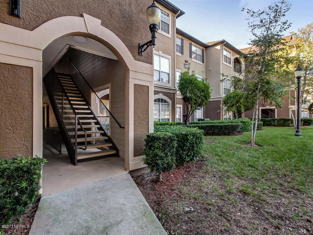 10961 Burnt Mill Road, Unit 1414 Jacksonville, FL 32256 - Photo 1 of 39 a view of a back yard of the house
