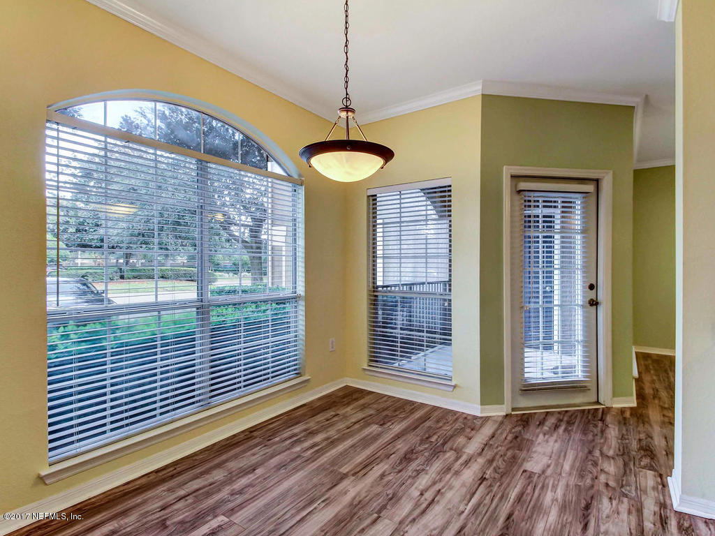 10961 Burnt Mill Road, Unit 1414 Jacksonville, FL 32256 - Photo 11 of 39 a view of an entryway with wooden floor