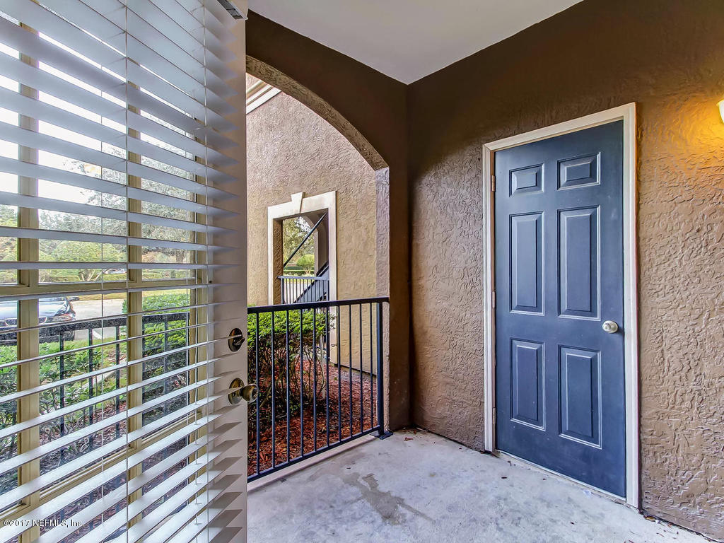 10961 Burnt Mill Road, Unit 1414 Jacksonville, FL 32256 - Photo 16 of 39 a view of balcony and window