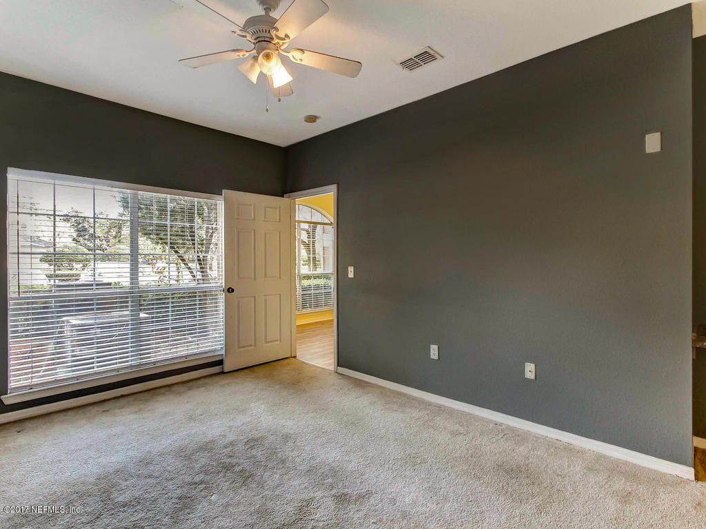 10961 Burnt Mill Road, Unit 1414 Jacksonville, FL 32256 - Photo 20 of 39 a view of an empty room with a window