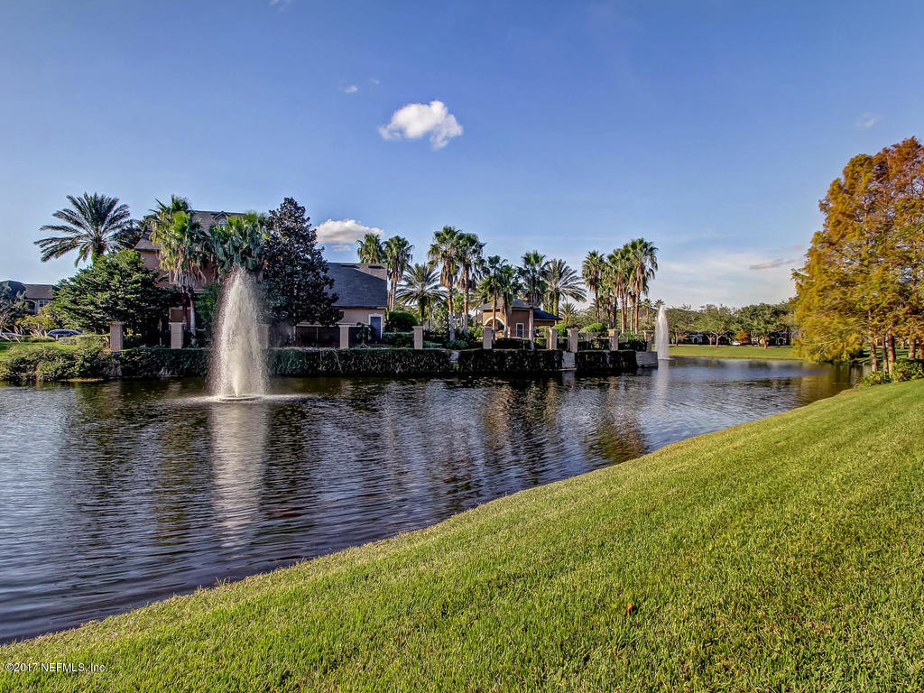 10961 Burnt Mill Road, Unit 1414 Jacksonville, FL 32256 - Photo 26 of 39 a view of a lake with a house