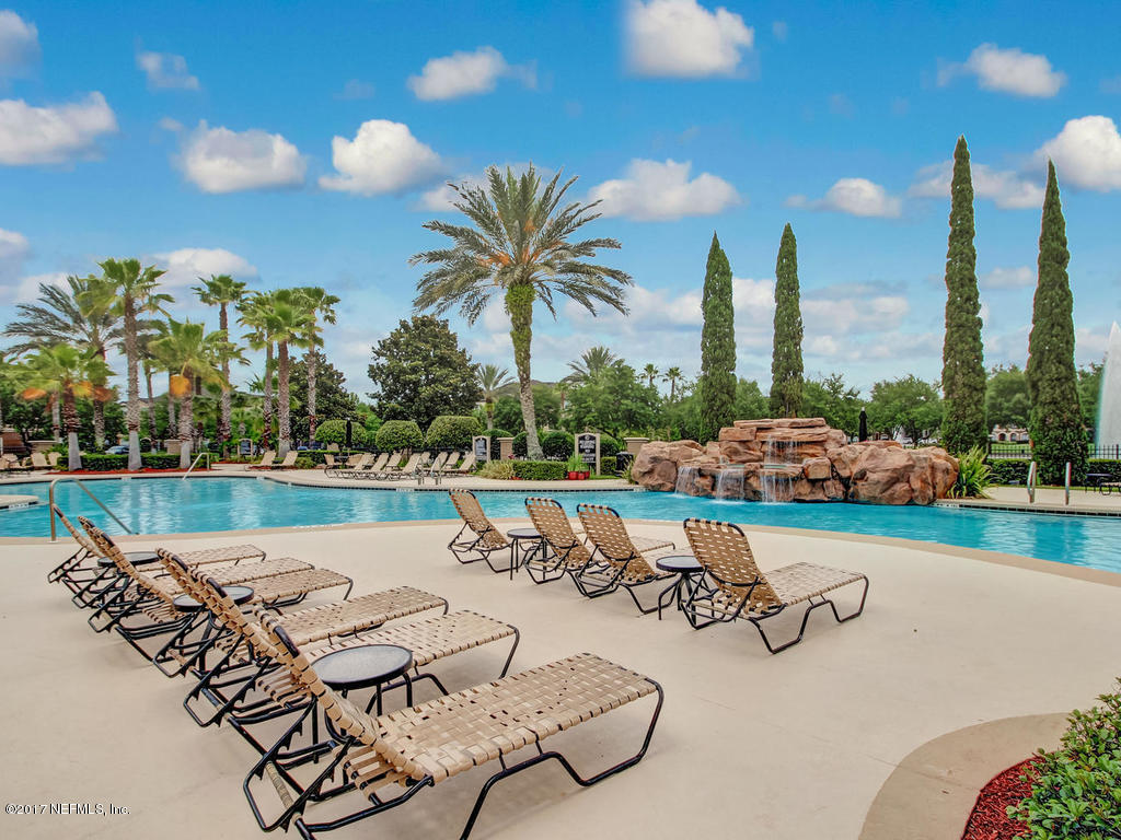 10961 Burnt Mill Road, Unit 1414 Jacksonville, FL 32256 - Photo 31 of 39 a view of a swimming pool and lounge chairs