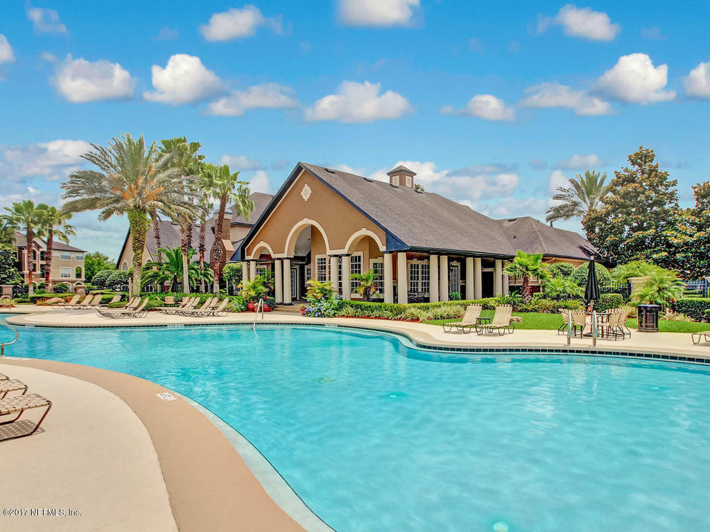 10961 Burnt Mill Road, Unit 1414 Jacksonville, FL 32256 - Photo 32 of 39 a view of a house with swimming pool and yard