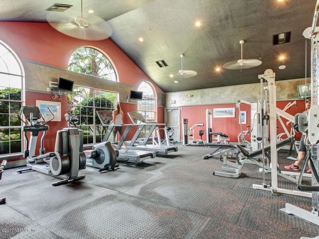 10961 Burnt Mill Road, Unit 1414 Jacksonville, FL 32256 - Photo 37 of 39 a view of a room with gym equipment
