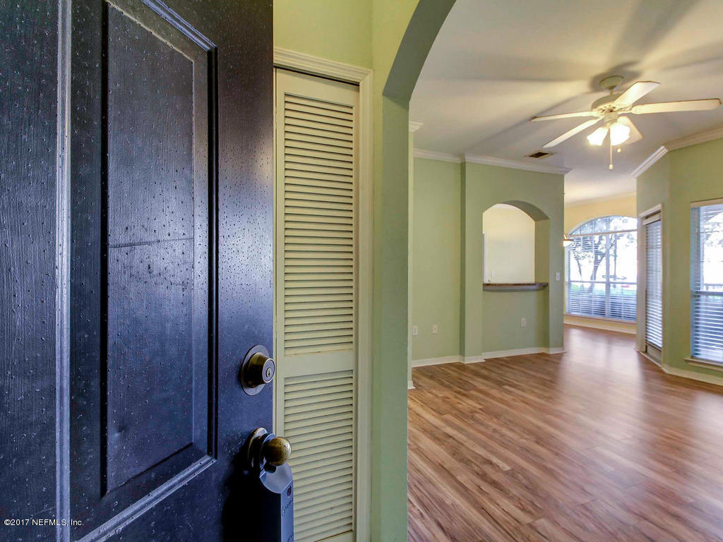 10961 Burnt Mill Road, Unit 1414 Jacksonville, FL 32256 - Photo 4 of 39 a view of hallway with livingroom and wooden floor