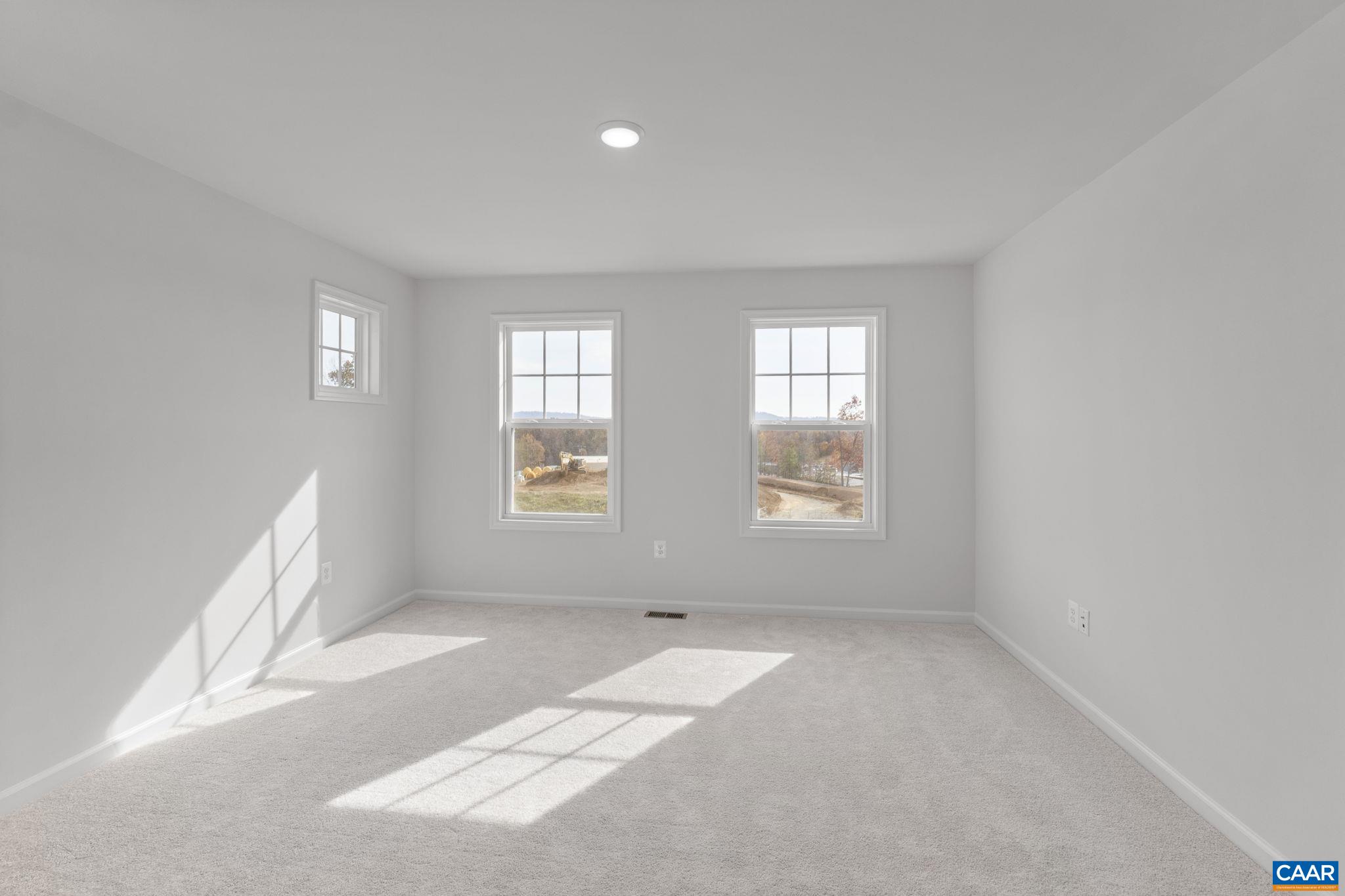 2209 Woodburn Road Charlottesville, VA 22901 - Photo 25 of 41 an empty room with windows