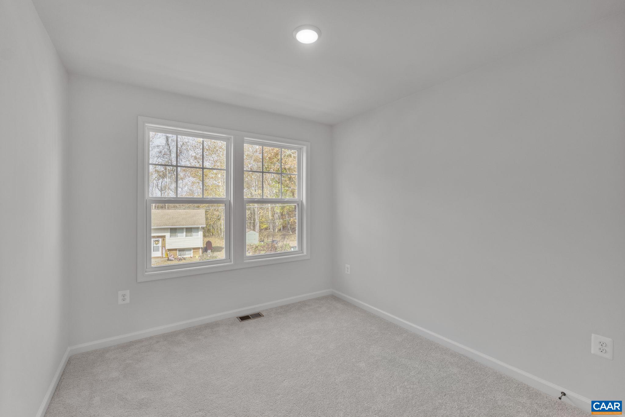 2209 Woodburn Road Charlottesville, VA 22901 - Photo 32 of 41 an empty room with a window
