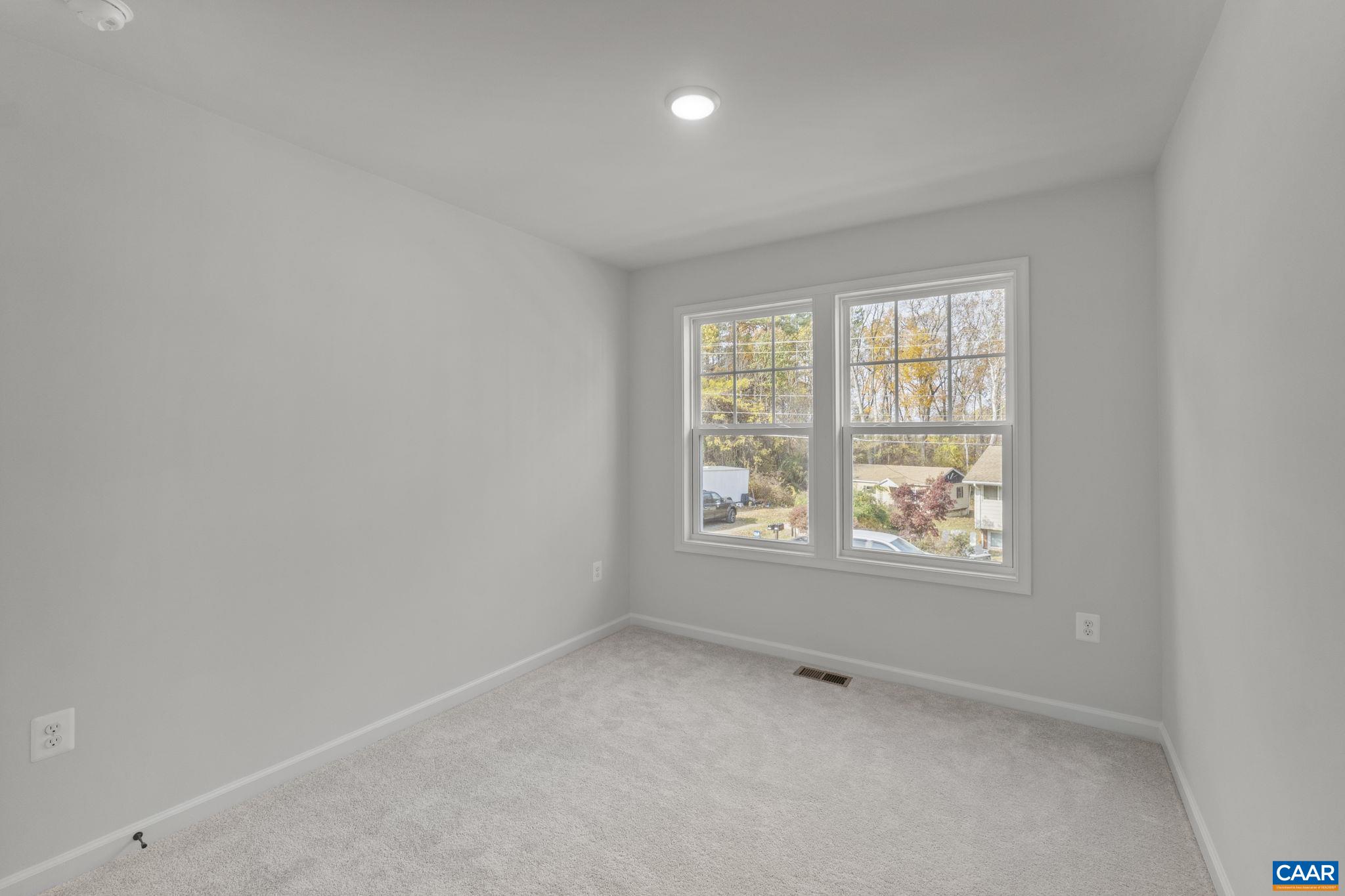 2209 Woodburn Road Charlottesville, VA 22901 - Photo 33 of 41 an empty room with a window