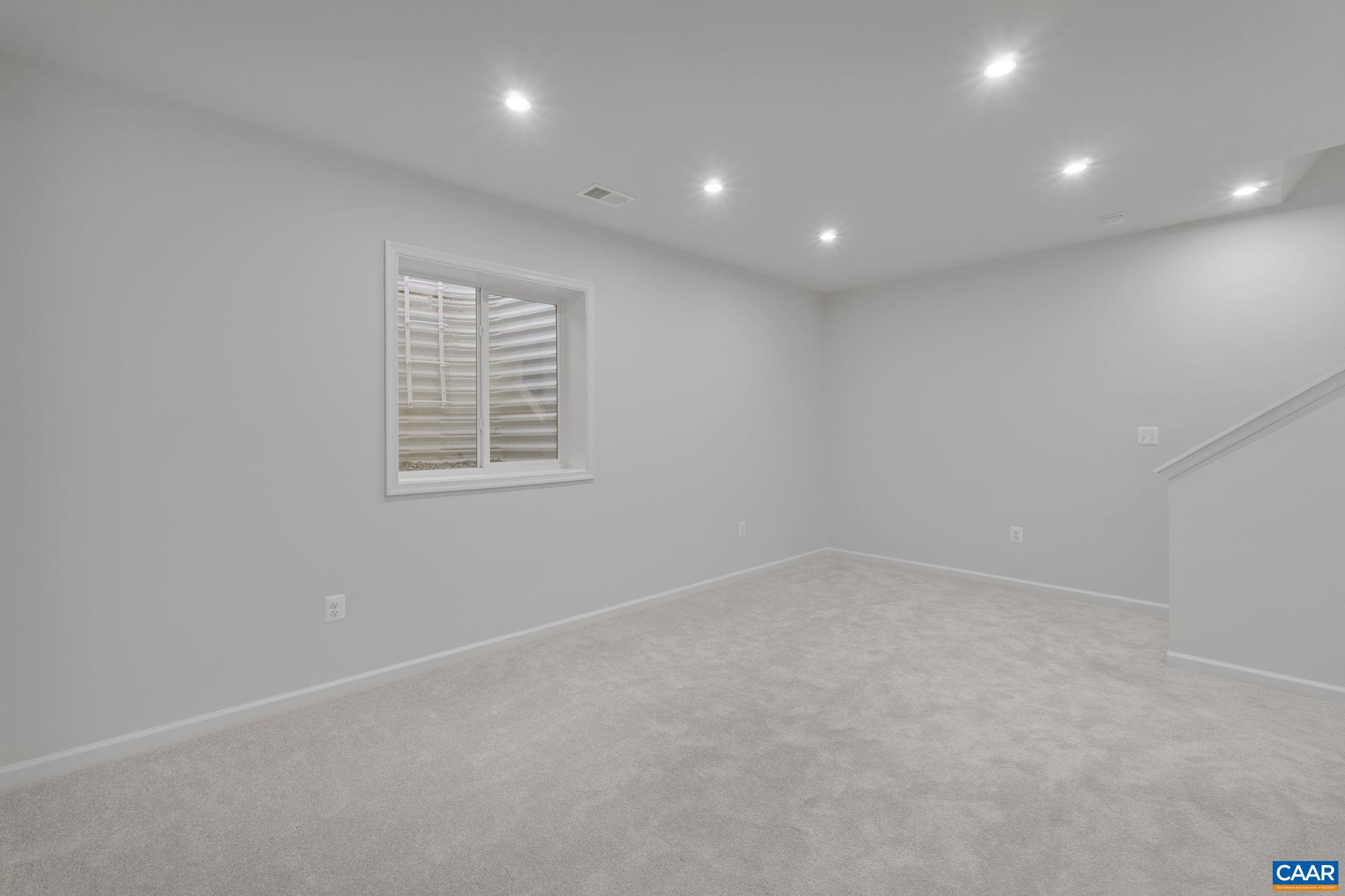 2209 Woodburn Road Charlottesville, VA 22901 - Photo 35 of 41 a view of an empty room with a window
