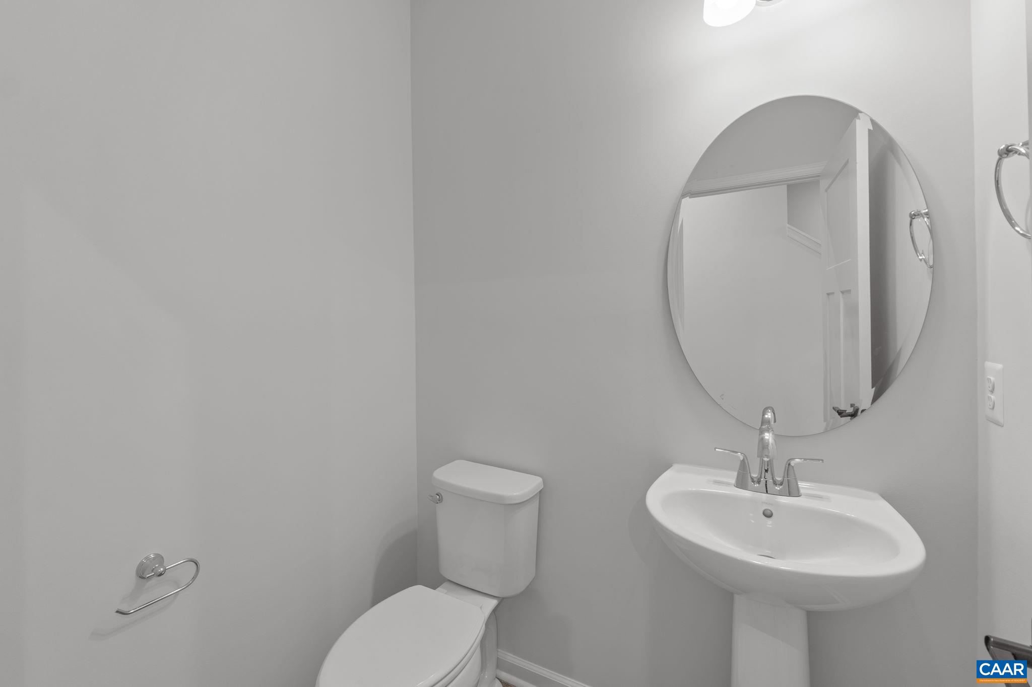 2209 Woodburn Road Charlottesville, VA 22901 - Photo 36 of 41 a bathroom with a sink a mirror and toilet