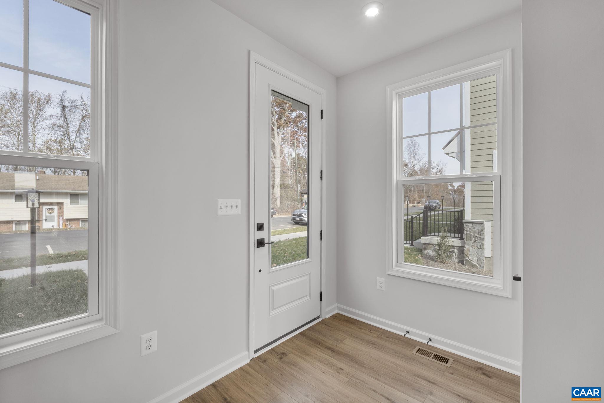 2209 Woodburn Road Charlottesville, VA 22901 - Photo 6 of 41 wooden floor in an empty room with a window
