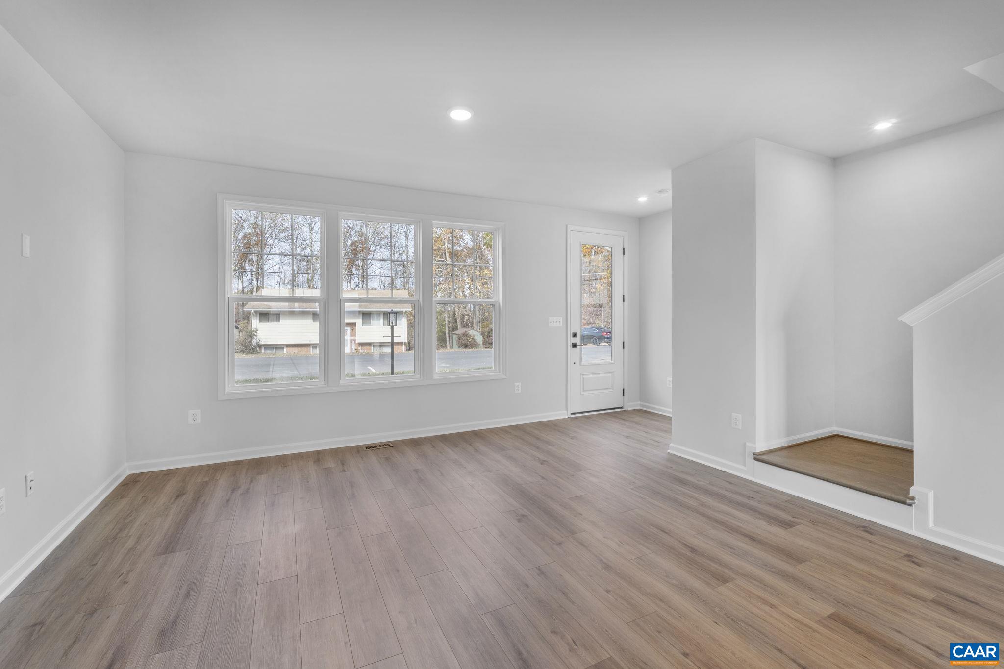 2209 Woodburn Road Charlottesville, VA 22901 - Photo 9 of 41 wooden floor in an empty room with a window