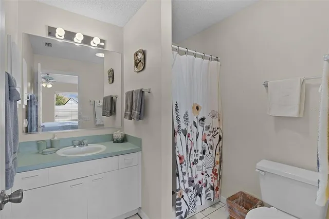 a bathroom with a shower and a sink