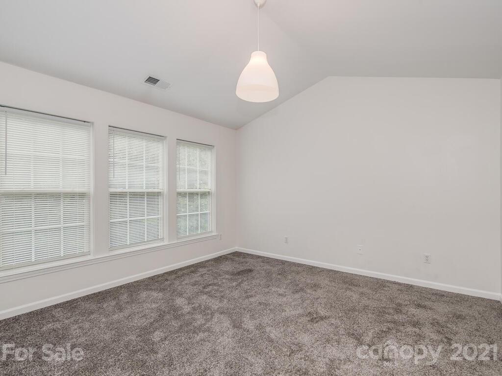 1108 Hannah Rae Court Charlotte, NC 28214 - Photo 12 of 16 an empty room with a empty space cabinets and windows