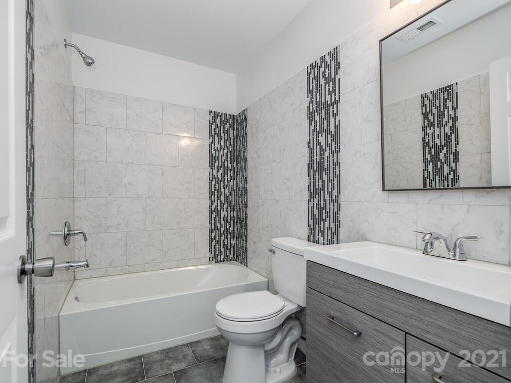 1108 Hannah Rae Court Charlotte, NC 28214 - Photo 13 of 16 a bathroom with a sink toilet and bathtub