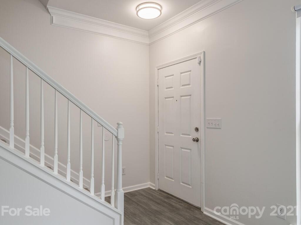 1108 Hannah Rae Court Charlotte, NC 28214 - Photo 3 of 16 a view of a hallway with wooden floor and entryway