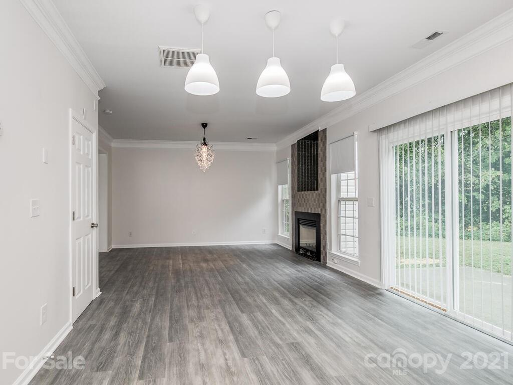 1108 Hannah Rae Court Charlotte, NC 28214 - Photo 10 of 16 wooden floor in an empty room with a window