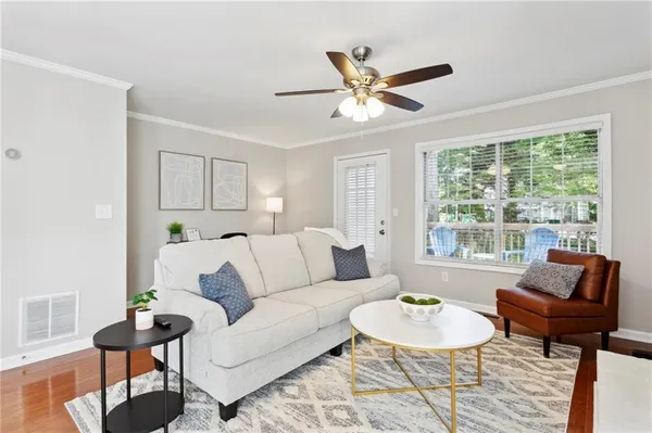 a living room with furniture and a large window