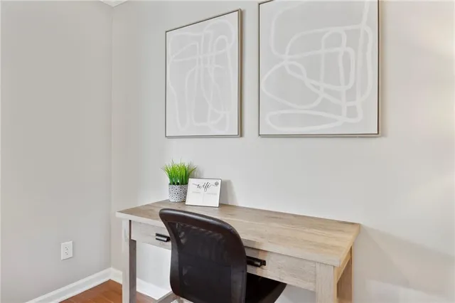 a view of a potted plant with white walls