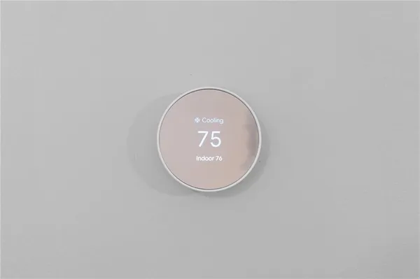 a kitchen with granite countertop white cabinets white stainless steel appliances with a sink and dishwasher