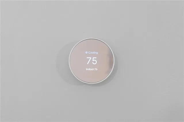 a kitchen with granite countertop white cabinets white stainless steel appliances with a sink and dishwasher