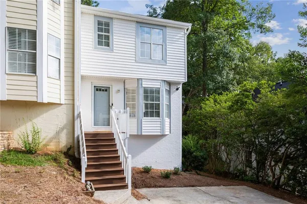 a view of a house with a small garden